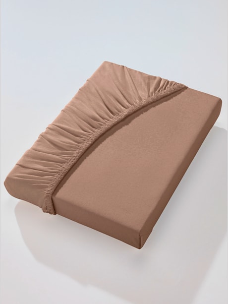 Drap-housse élastique et tricoté serré